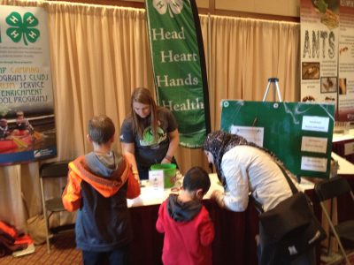 Hands on Activities at BugFest with collegiate volunteer.